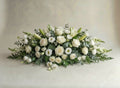 Signature Neutrals casket spray featuring premium white roses, snapdragons, lisianthus and lilies